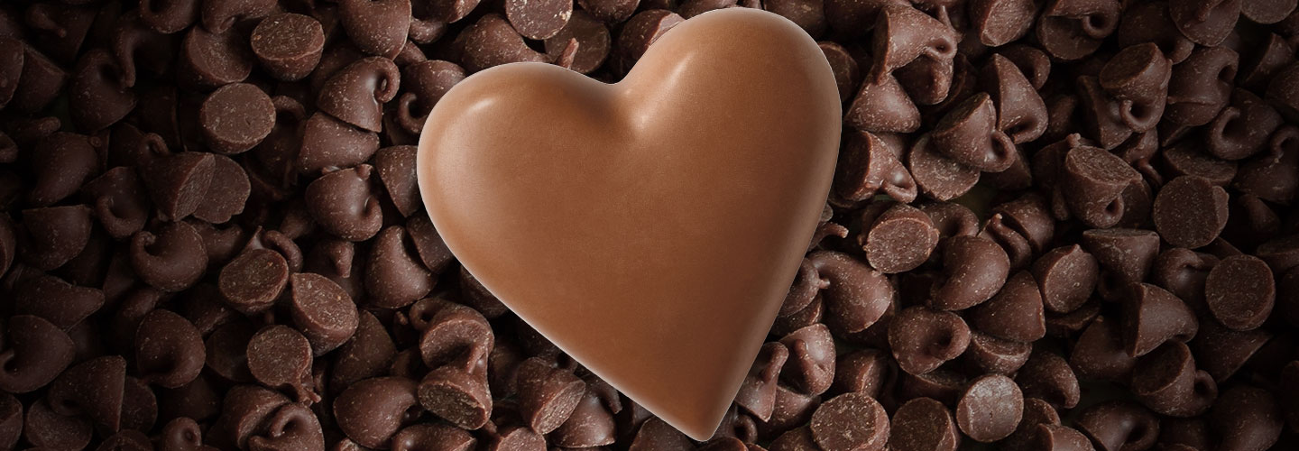 Image of a chocolate heart against a background of chocolate chips